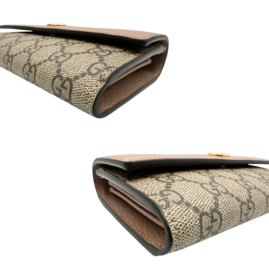 Portafoglio Gucci in canvas GG con fintiure in pelle rosa