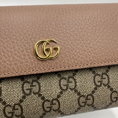 Portafoglio Gucci in canvas GG con fintiure in pelle rosa