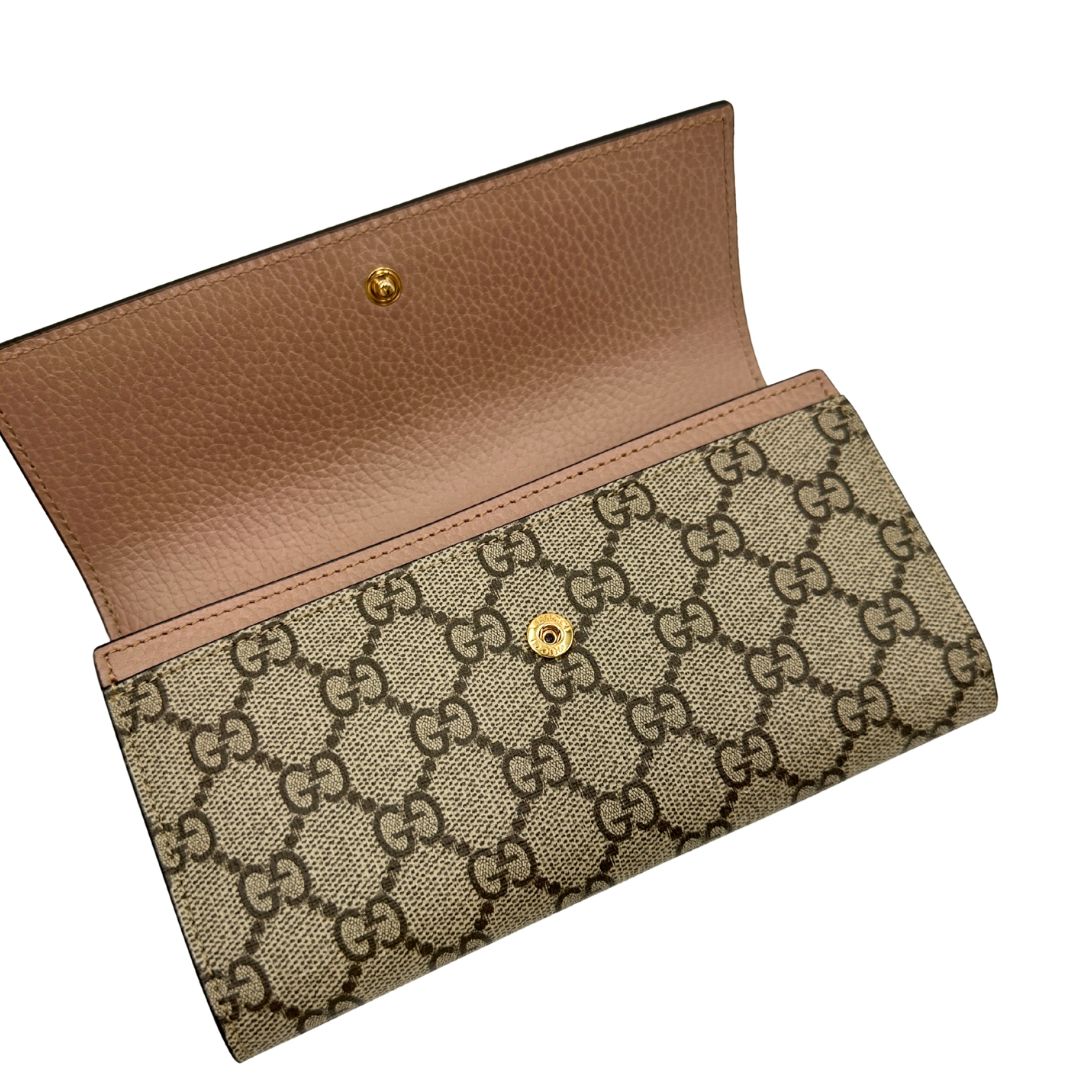 Portafoglio Gucci in canvas GG con fintiure in pelle rosa
