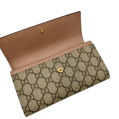 Portafoglio Gucci in canvas GG con fintiure in pelle rosa