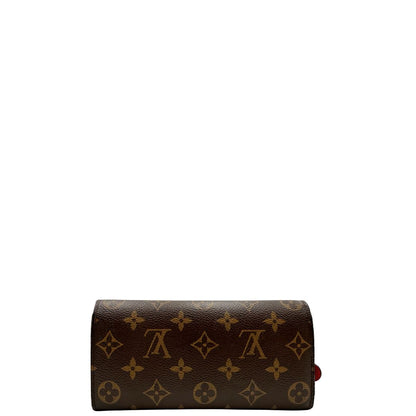 Retro, Portafoglio Louis Vuitton Emilie Bloom Flower realizzato in tela Monogram ed è impreziosito da un bottone a forma di fiore. Originale, usato, di lusso, in ottime condizioni.