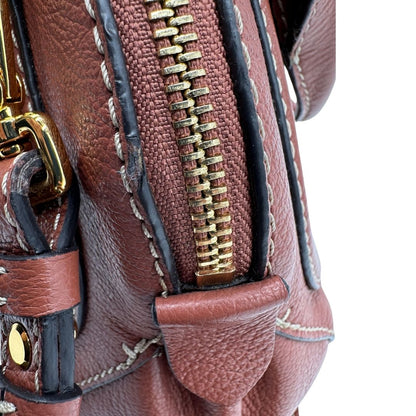Borsa Coccinelle in pelle color marsala con hardware dorato, di lusso, originale, ottime condizioni, usata