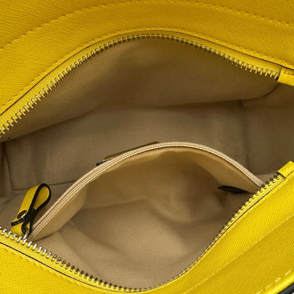 interno Borsa Coccinelle in pelle saffiano gialla 