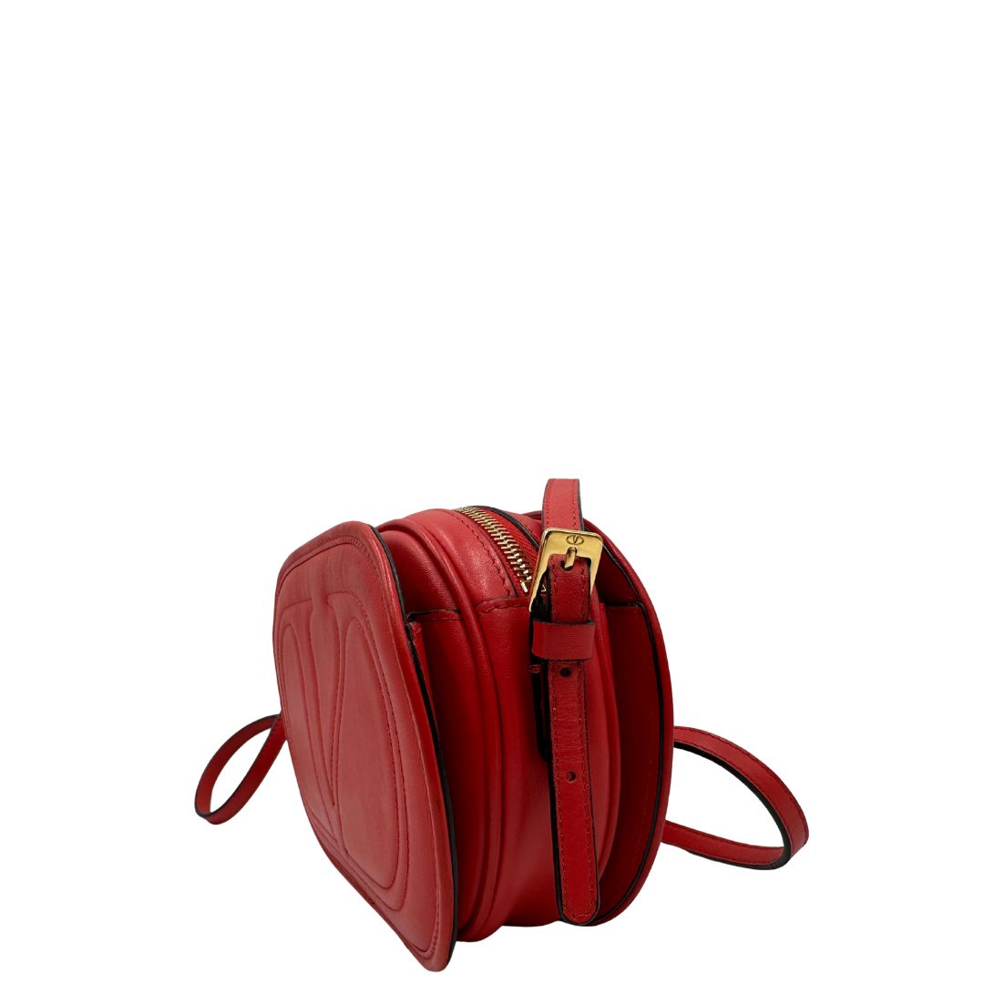 lato Borsa VG in pelle rossa con parti metalliche dorate 