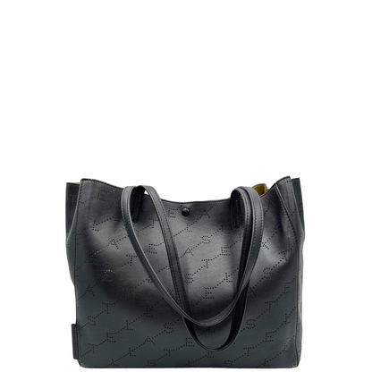 Retro, Borsa Stella McCartney in pelle nera caratterizzata dal motivo logo traforato.  Originale, usata, di lusso, in ottime condizioni.