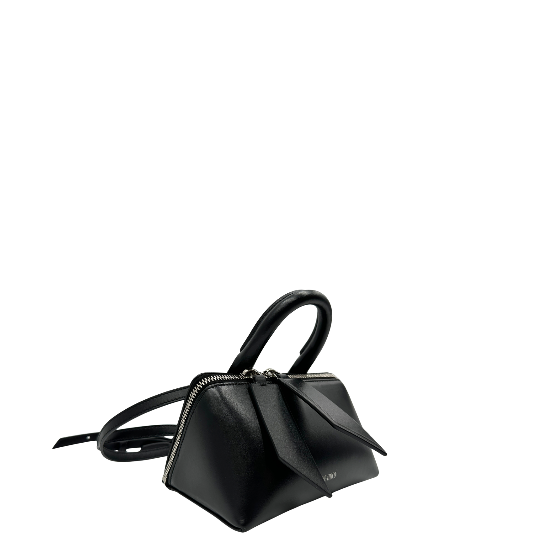 Lato, Borsa The Attico in pelle nera rifinita con parti metalliche argentate; munita di un manico singolo e una tracolla amovibile che diventa anche marsupio. Originale, usata, di lusso, in ottime condizioni