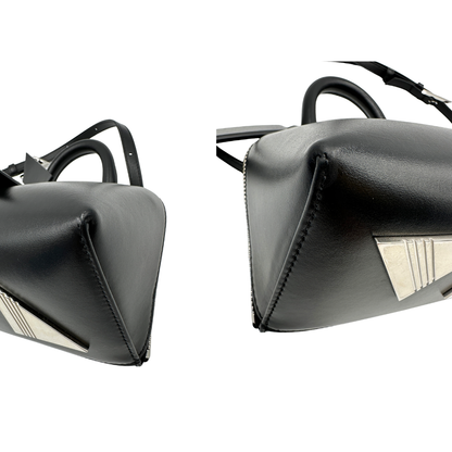 Angoli, Borsa The Attico in pelle nera rifinita con parti metalliche argentate; munita di un manico singolo e una tracolla amovibile che diventa anche marsupio. Originale, usata, di lusso, in ottime condizioni