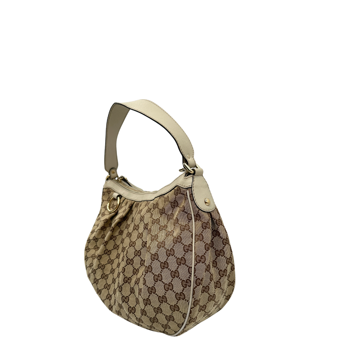 lato Borsa Gucci in tessuto GG e pelle bianco avorio, di lusso, originale, usata