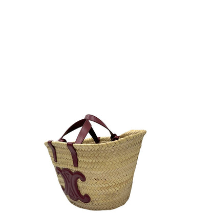Laterale, Borsa Celine in rafia beige e finiture in pelle bordeaux, munita di doppi manici e una tracolla in pelle. Indossabile a mano oppure a spalla. Originale, usata, di lusso, in ottime condizioni.