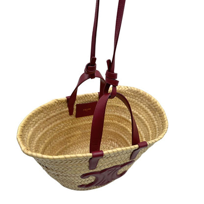 Borsa Celine in rafia beige e finiture in pelle bordeaux, munita di doppi manici e una tracolla in pelle. Indossabile a mano oppure a spalla. Originale, usata, di lusso, in ottime condizioni.