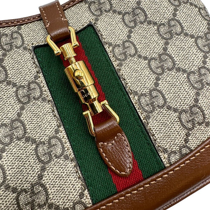  Borsa Gucci Jackie in canvas GG e pelle marrone, munita di un elemento allungabile per poterla portare comodamente a tracolla, di lusso, originale, eccellenti condizioni, usata. 