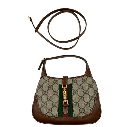  Borsa Gucci Jackie in canvas GG e pelle marrone, munita di un elemento allungabile per poterla portare comodamente a tracolla, di lusso, originale, eccellenti condizioni, usata. 