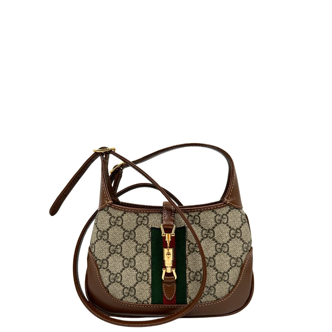  Borsa Gucci Jackie in canvas GG e pelle marrone, munita di un elemento allungabile per poterla portare comodamente a tracolla, di lusso, originale, eccellenti condizioni, usata. 