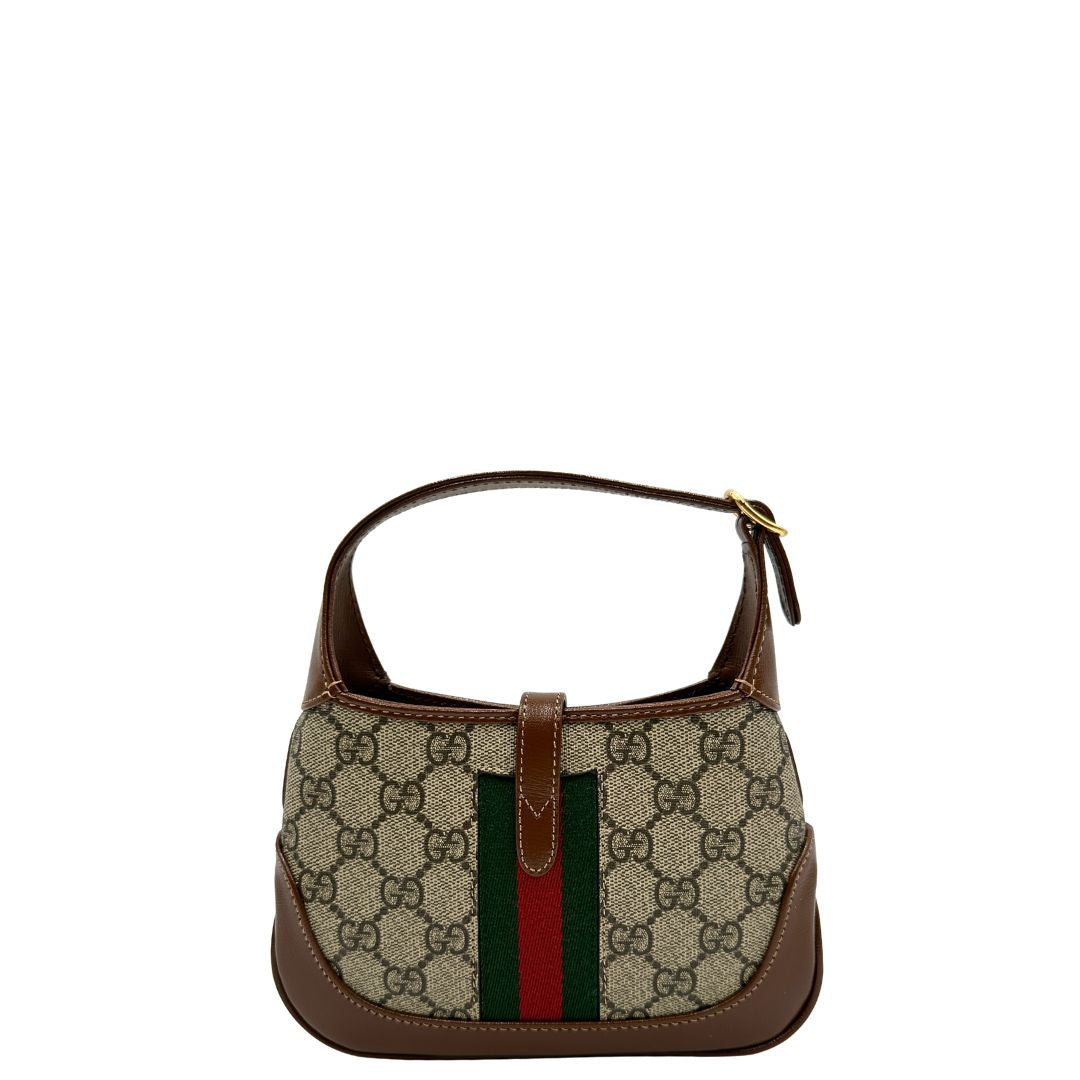 retro  Borsa Gucci Jackie in canvas GG e pelle marrone, munita di un elemento allungabile per poterla portare comodamente a tracolla, di lusso, originale, eccellenti condizioni, usata. 