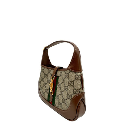 lato  Borsa Gucci Jackie in canvas GG e pelle marrone, munita di un elemento allungabile per poterla portare comodamente a tracolla, di lusso, originale, eccellenti condizioni, usata.  