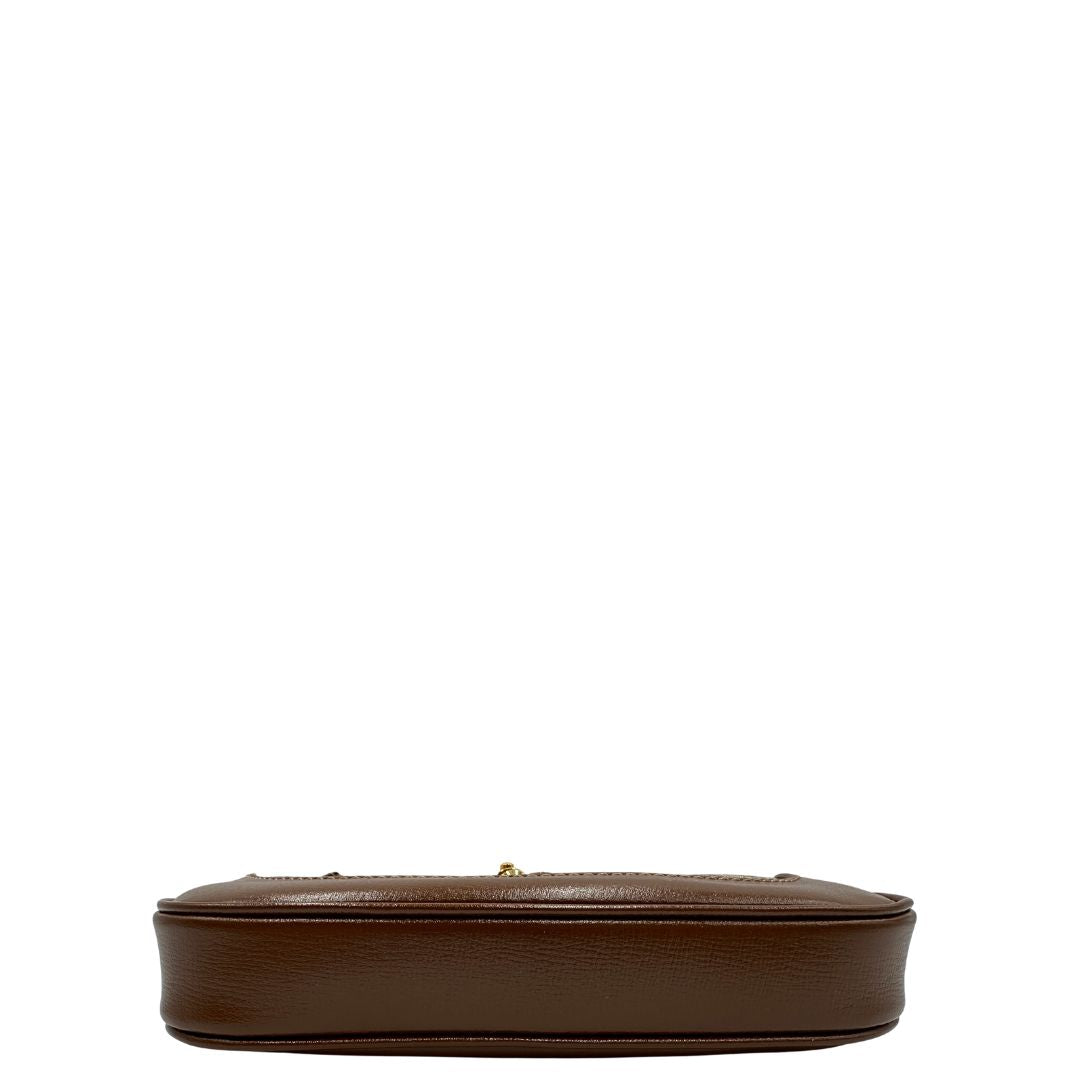 base  Borsa Gucci Jackie in canvas GG e pelle marrone, munita di un elemento allungabile per poterla portare comodamente a tracolla, di lusso, originale, eccellenti condizioni, usata. 
