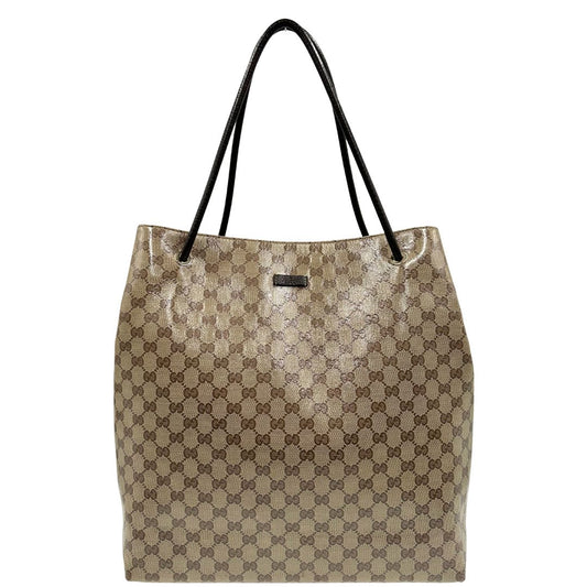 front  Borsa Gucci in tela cerata lucida beige GG con finiture in pelle marroni; munita di doppi manici, indossabile a spalla. Completa di dustbag, di lusso, ottime condizioni, usata. 