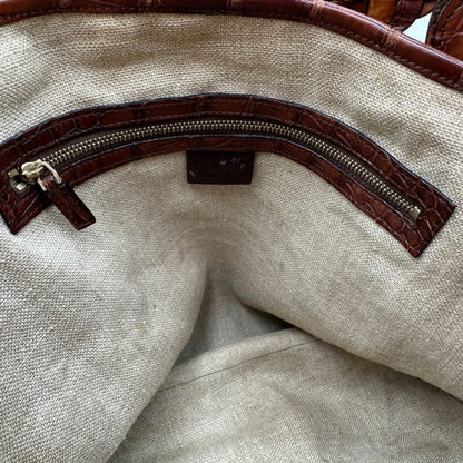 interno Borsa Gucci caratterizzata da un corpo in rafia intrecciata, manici in pelle intrecciata e dettagli in metallo dorato, di lusso, originale, ottime condizioni.