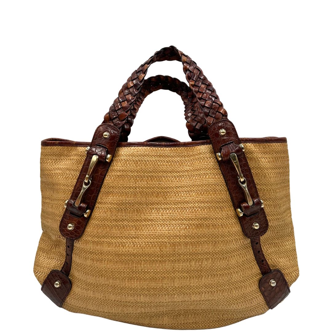retro Borsa Gucci caratterizzata da un corpo in rafia intrecciata, manici in pelle intrecciata e dettagli in metallo dorato, di lusso, originale, ottime condizioni. 
