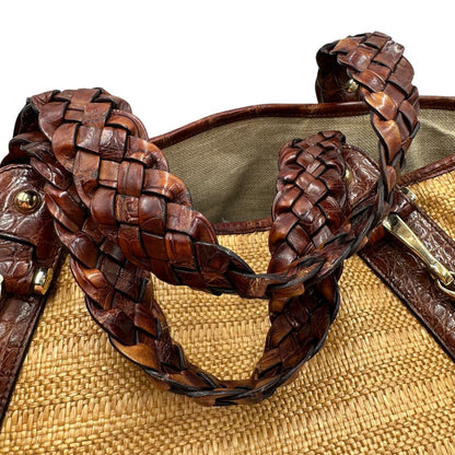 manici  Borsa Gucci caratterizzata da un corpo in rafia intrecciata, manici in pelle intrecciata e dettagli in metallo dorato, di lusso, originale, ottime condizioni.