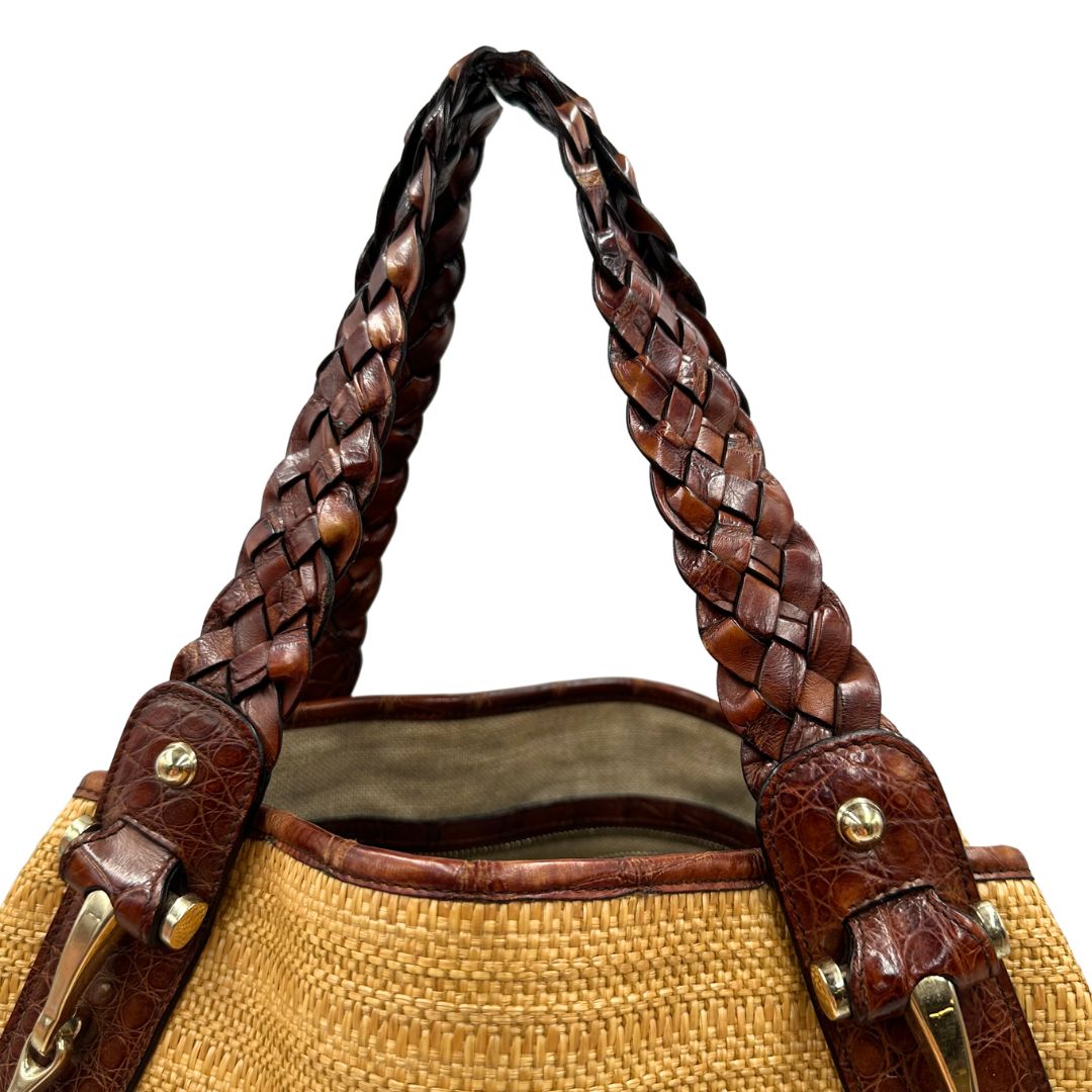 manici Borsa Gucci caratterizzata da un corpo in rafia intrecciata, manici in pelle intrecciata e dettagli in metallo dorato, di lusso, originale, ottime condizioni. 