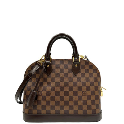  Front,Strutturata borsa Alma PM LV in canvas Damier Ébène e hardware dorato, indossabile a mano oppure a tracolla.