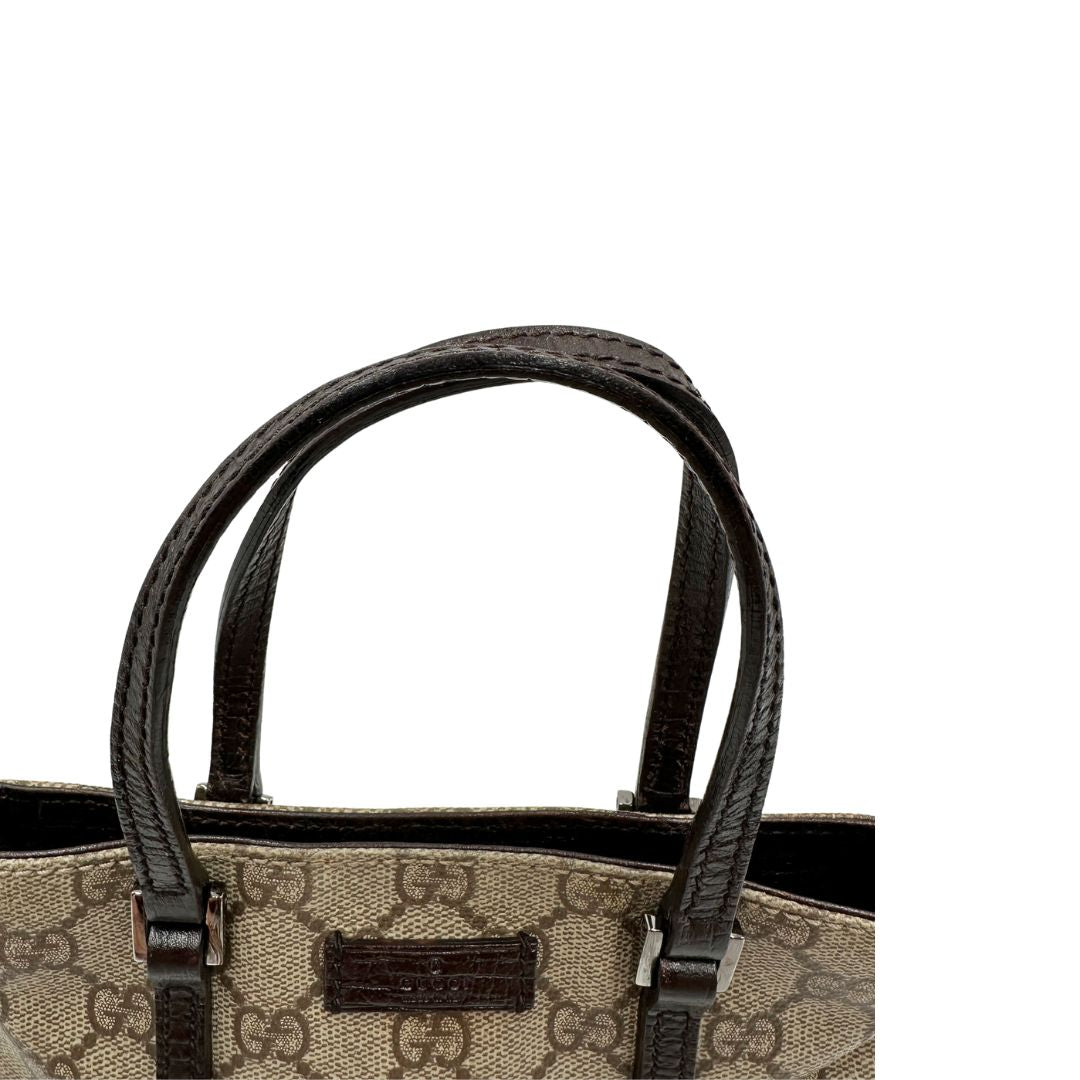 Manici, Borsa Gucci GG in canvas beige e dettagli in pelle marroni testa di moro, indossabile a mano. Originale, usata, di lusso, in ottime condizioni.