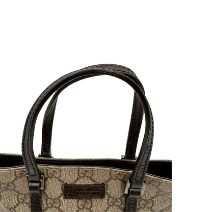 Manici, Borsa Gucci GG in canvas beige e dettagli in pelle marroni testa di moro, indossabile a mano. Originale, usata, di lusso, in ottime condizioni.