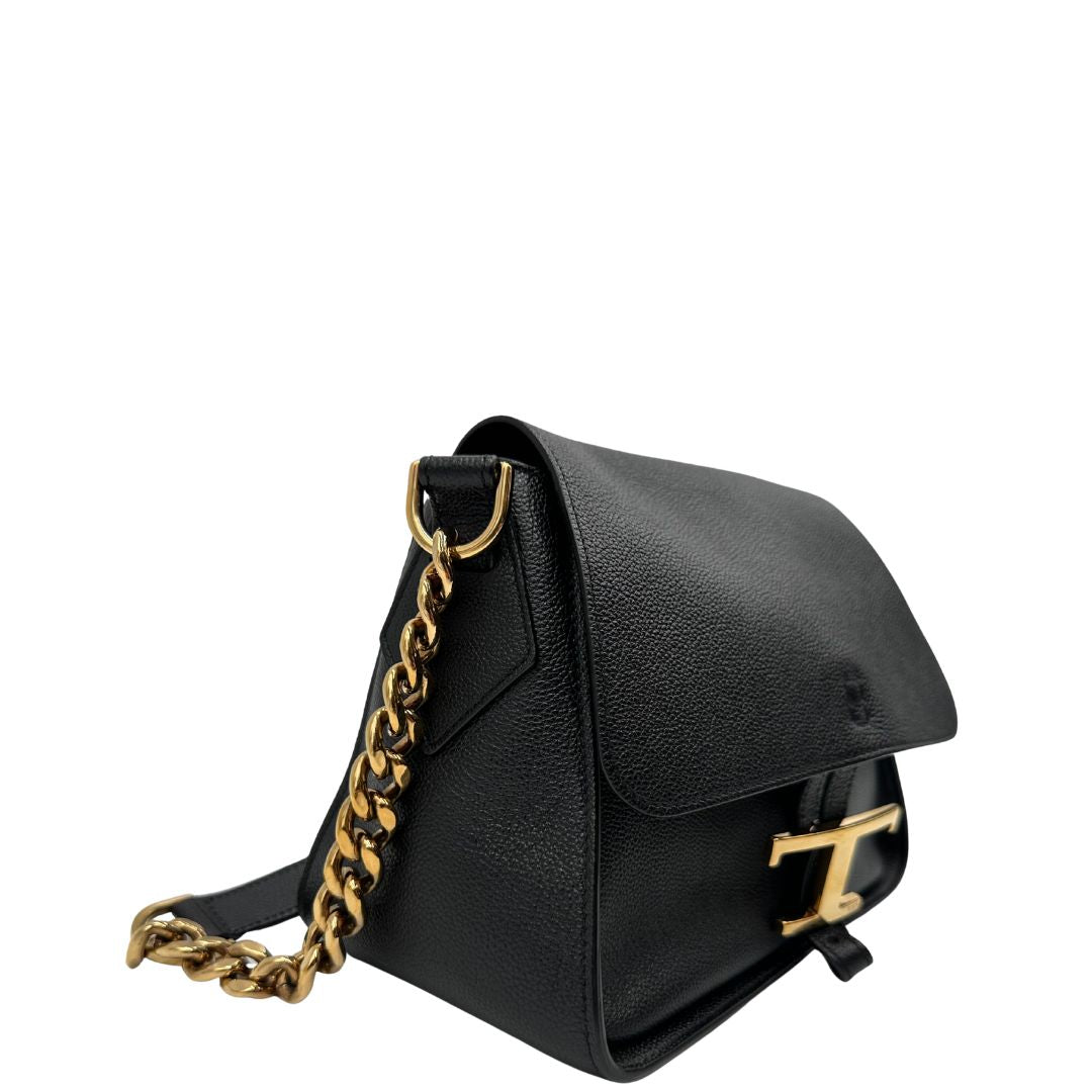 Lato destro, Borsa Tod's in pelle martellata nera con hardware dorato, indossabile a tracolla. Originale, usata, di lusso, in ottime condizioni.