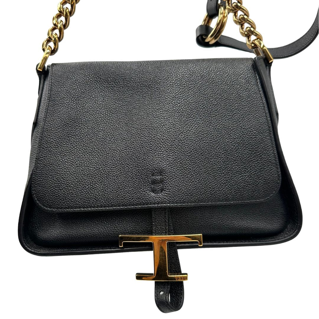 Borsa Tod's in pelle martellata nera con hardware dorato, indossabile a tracolla. Originale, usata, di lusso, in ottime condizioni.