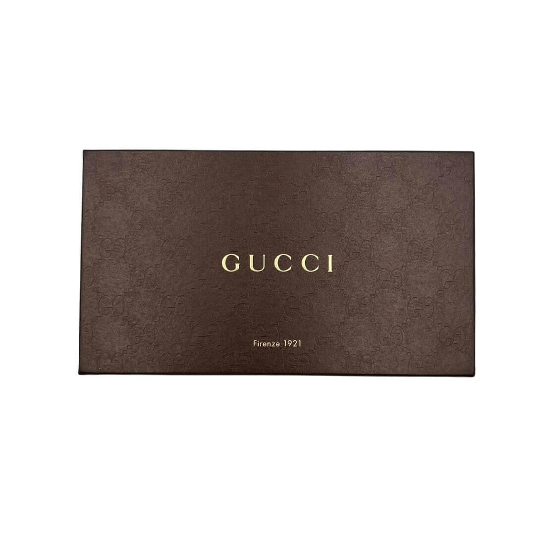Foto portafoglio Gucci in pelle marrone animalier. Accessori di marca usati.