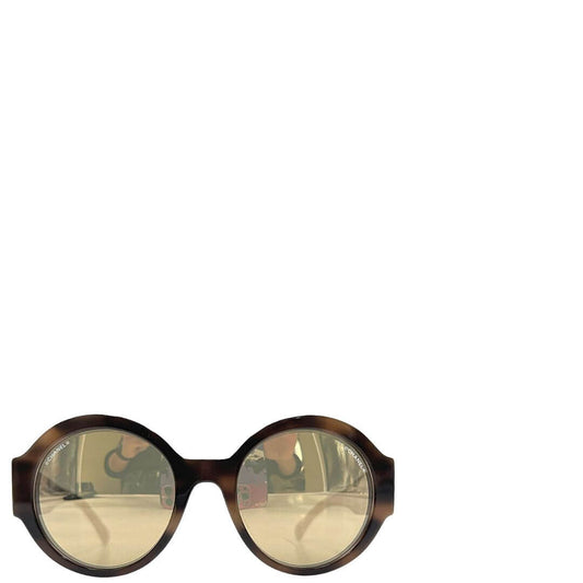 Foto occhiali Chanel rotondi con montatura Camouflage. Accessori di marca usati